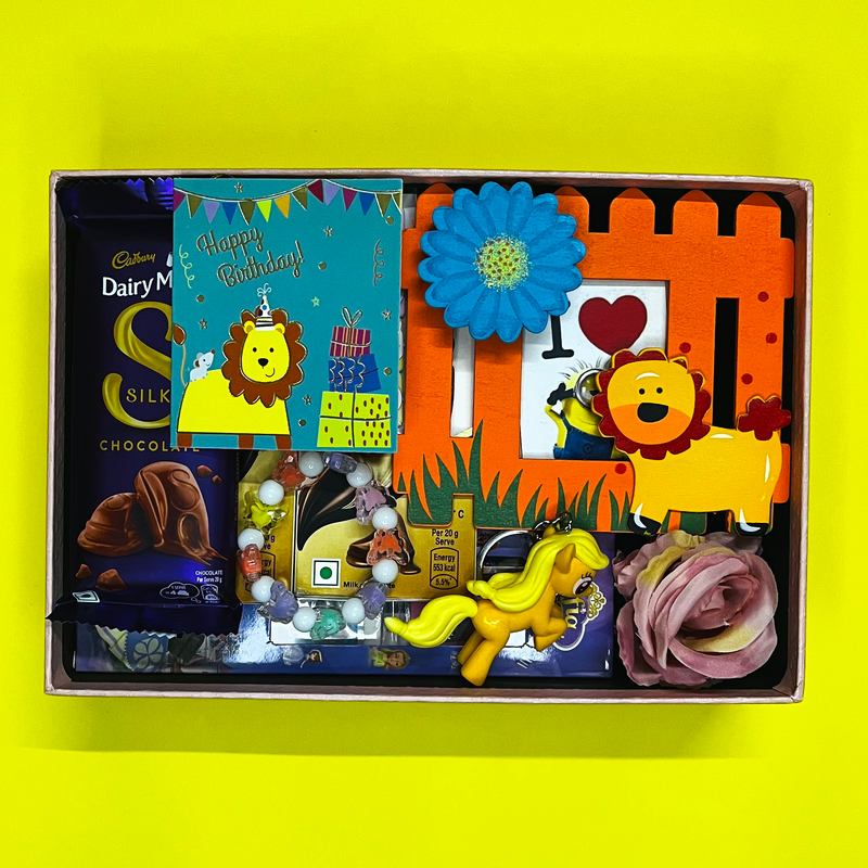 Kids' birthday gift box with a lion photo frame, toys, a Happy Birthday card and chocolates